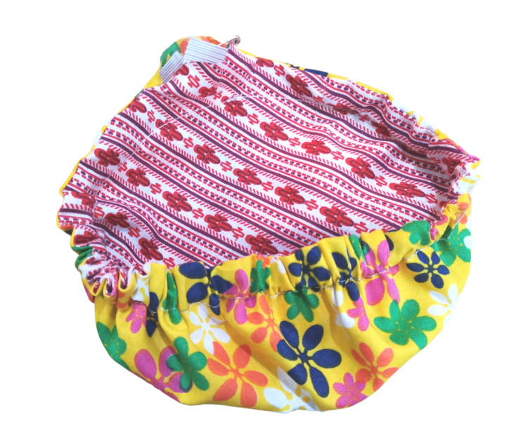 Secure the elastic. Fabric bowl cover keeps food safe for home and outdoor camping or party use.