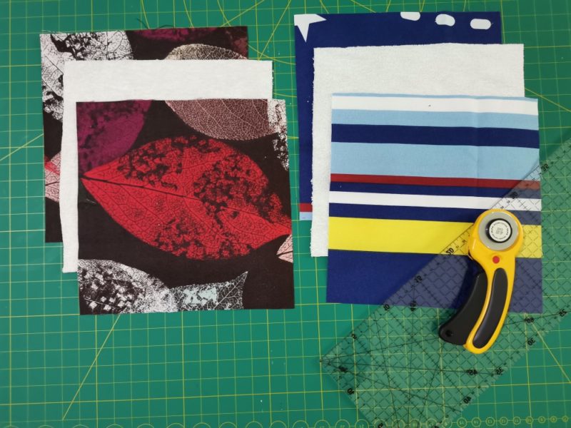 Cut fabrics for DIY potholders with ruler and rotary cutter