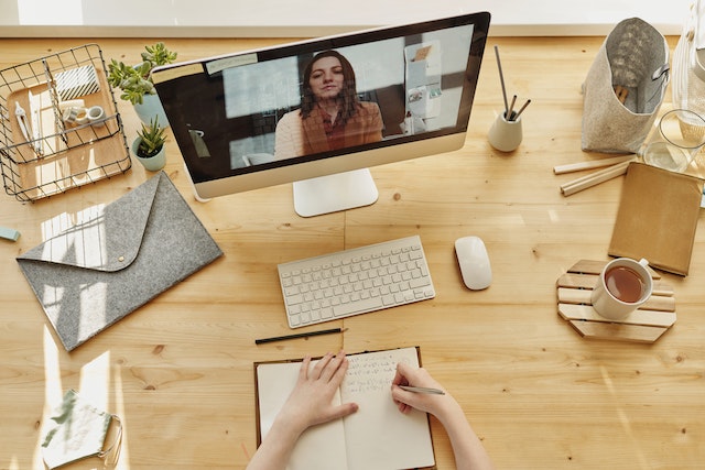 A person taking an online course through a computer.